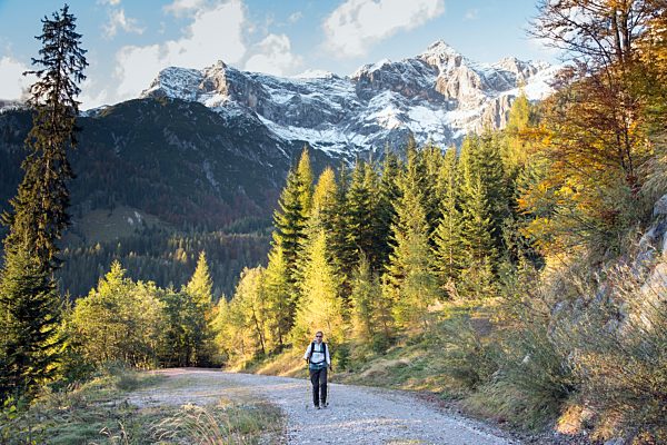 Austria, Salzburg State, Maria Alm, woman hiking in alpine landscape
