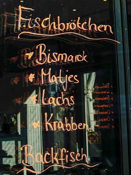 Germany, Hamburg, choice of a snack bar written on windowpane
