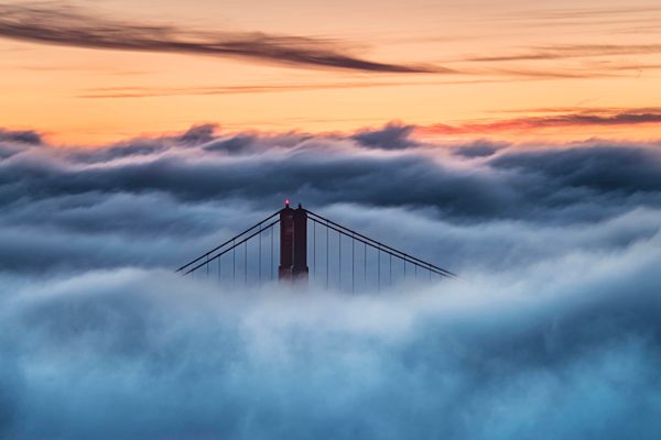 USA, San Francisco, Golden Gate bridge in fog at sunset