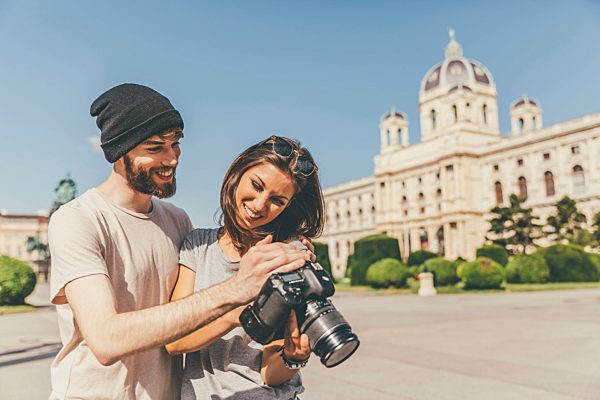 Young couple with camera in Vienna