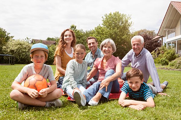 Portrait of happy extended family in garden