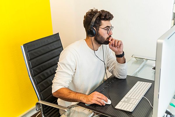 Young man working with computer in an office