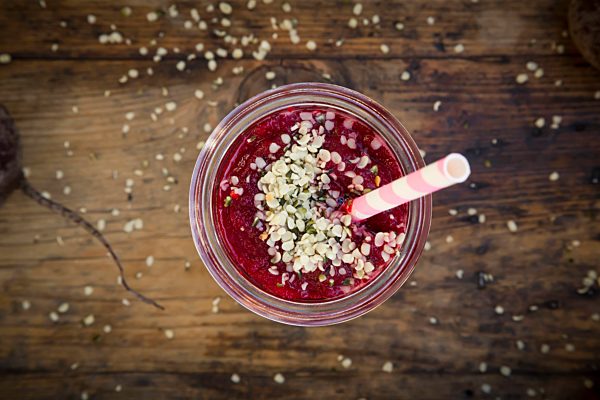 Glass of beetroot smoothie with hemp seed