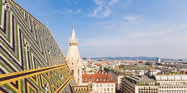 Austria, Vienna, cityscape with colored roof tiles and Stephansdom