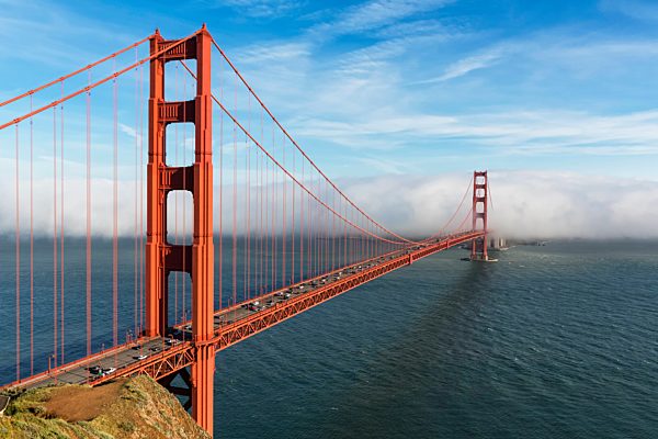 USA, California, San Francisco, Golden Gate Bridge seen from Hawk Hill with fog hiding city