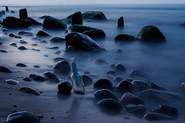 Germany, Mecklenburg-Western Pomerania, Ruegen, Message in a bottle at beach