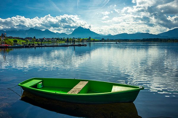Germany, Bavaria, Allgaeu, East Allgaeu, Hopfen am See near Fuessen, Lake Hopfensee, green rowing boat