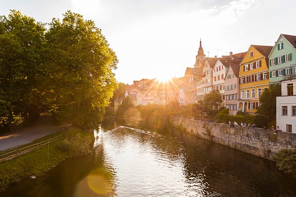 Germany, Tuebingen, view to the city with Neckar River in the foreground at evening twilight
