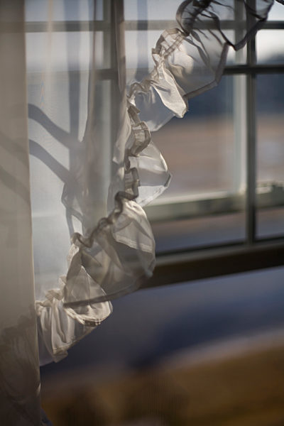 Detail of a curtain in front of a window
