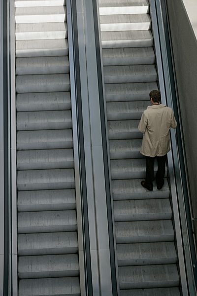 A man going up an escalator