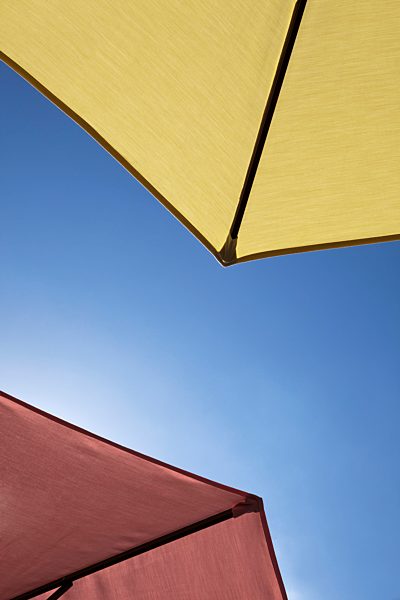 Two beach umbrellas, close-up, directly below