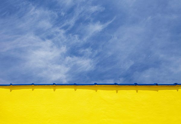 Low angle close up view of a wall and sky