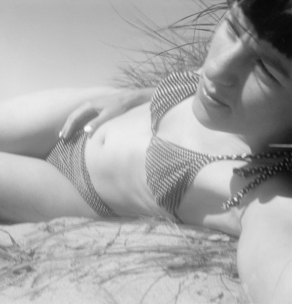 A woman in a bikini on the beach