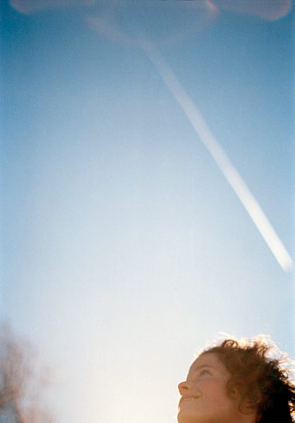 A woman smiling in the sunshine