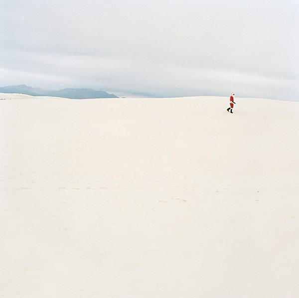 Santa Claus walking in the desert, New Mexico, USA
