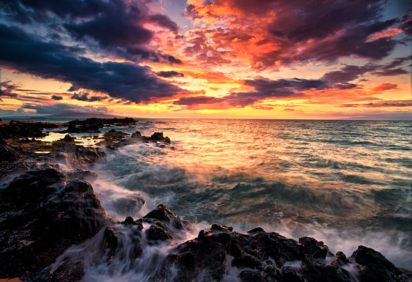 Dramatic Colourful Sky At Sunset Over The Pacific Ocean And The Rugged Coastline Of A Hawaiian Island; Hawaii, United States Of America