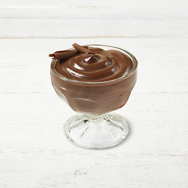 Chocolate pudding in a glass cup with chocolate shavings as a garnish