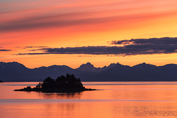 A Summer Sunset Colours The Sky Adjacent To Lynn Canal, With Chilkat Mountains In The Distance; Alaska, United States Of America