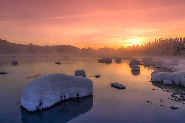 Winter sunset along the shoreline of Mendenhall River, Tongass National Forest; Juneau, Alaska, United States of America