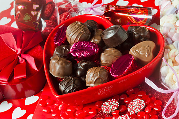 Valentines heart-shaped tray with an assortment of treats.