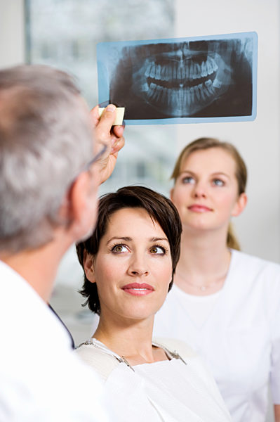 Dentist with patients x-ray