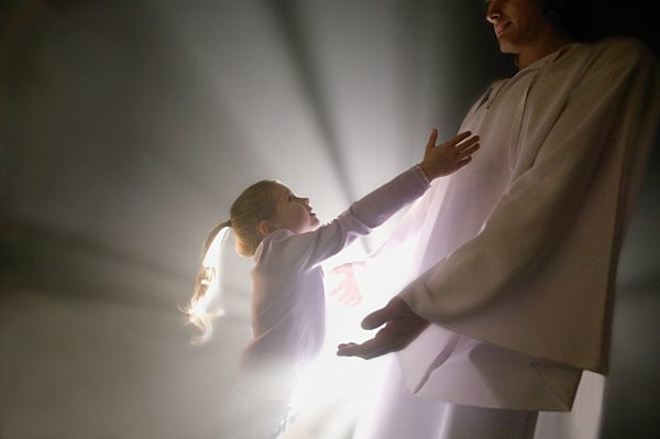 Child runs into the arms of Jesus