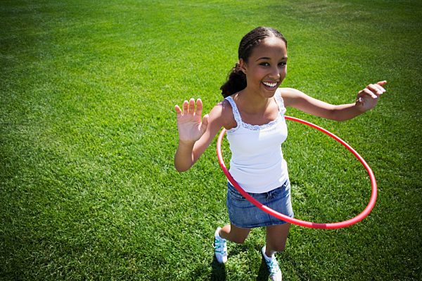 Child plays with hoop