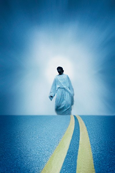 Jesus walks along a modern road