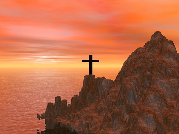 Cross on rugged hillside