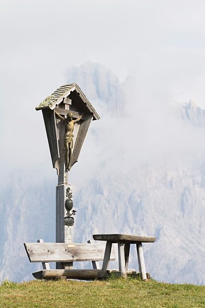 memorial crucifix on a mountain, siusi allo sciliar, alto adige, italy