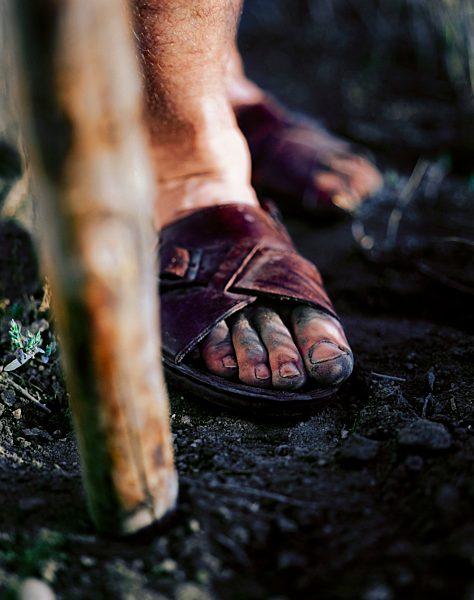 A person standing with cane
