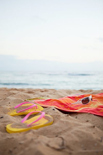 Flips flops and towel on beach