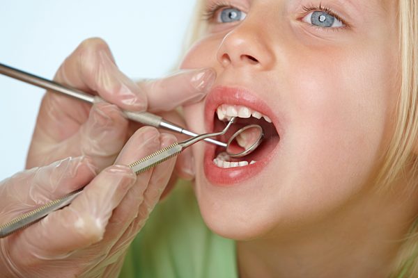 Girl having dental check up