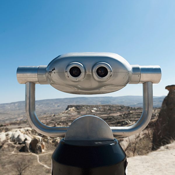 Binoculars With A View Of The Landscape And A Blue Sky; Urgup Nevsehir Turkey
