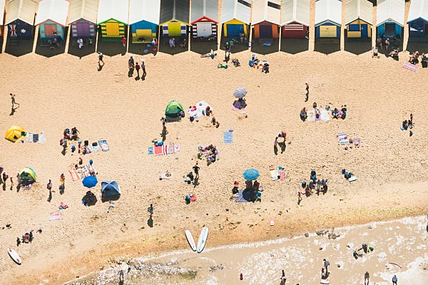 Aerial view of holiday makers and beach huts on Brighton beach, Melbourne, Victoria, Australia
