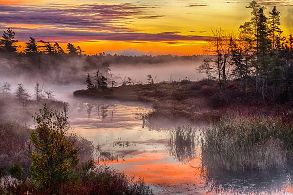 Morning Mists Rises Off Rocky Lake; Bedford, Nova Scotia, Canada