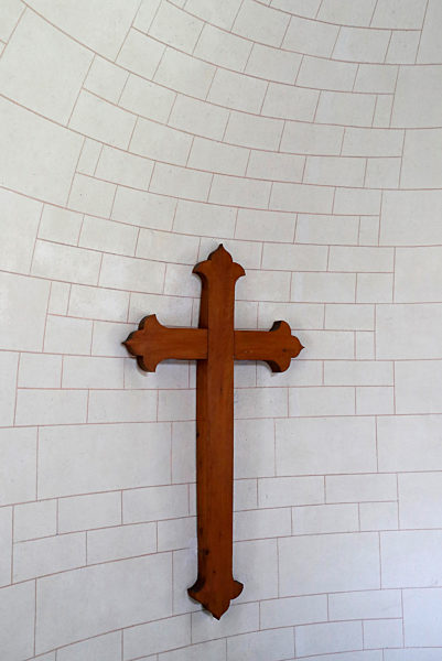 Protestant church. Christian cross on the wall.  France.