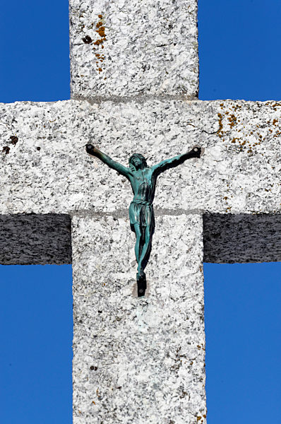 Jesus christ on calvary againt blue sky.  Megeve. France.