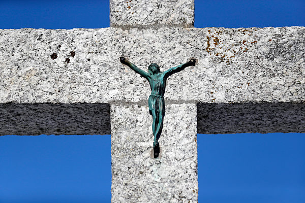 Jesus christ on calvary againt blue sky.  Megeve. France.