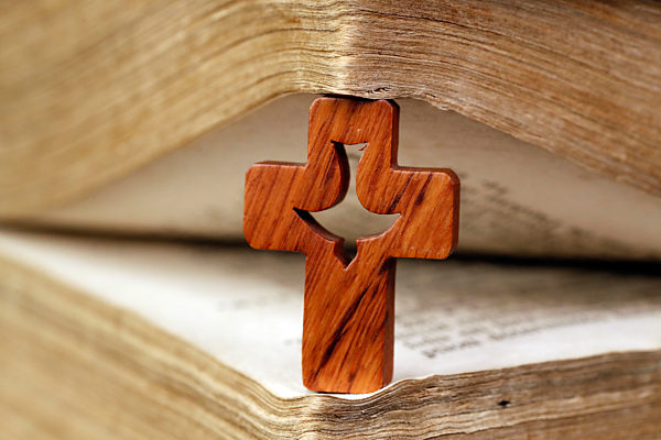 Christian cross with Holy Spirit and old Bible. 18 th century.  France.