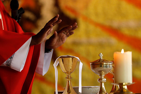 Coronvarius epidemic (Covid-19). Celebration of the Pentecost Mass after lockdown. Eucharist celebration.  Saint Louis de Novel Church.  Annecy. France.