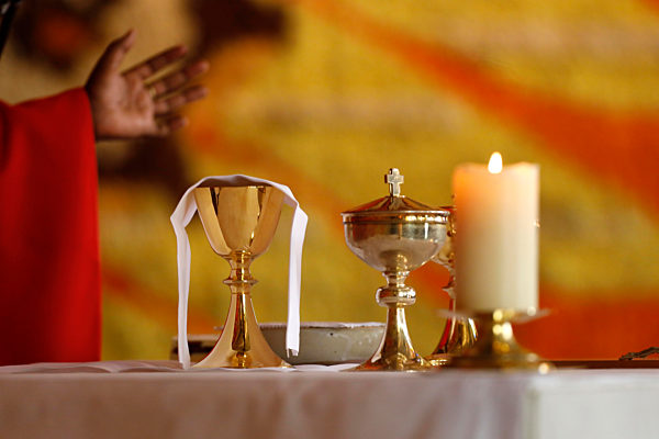 Coronvarius epidemic (Covid-19). Celebration of the Pentecost Mass after lockdown. Eucharist celebration.  Saint Louis de Novel Church.  Annecy. France.
