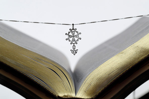 Open Bible and the Huguenot cross,  a popular symbol of the evangelical reformed faith. France.
