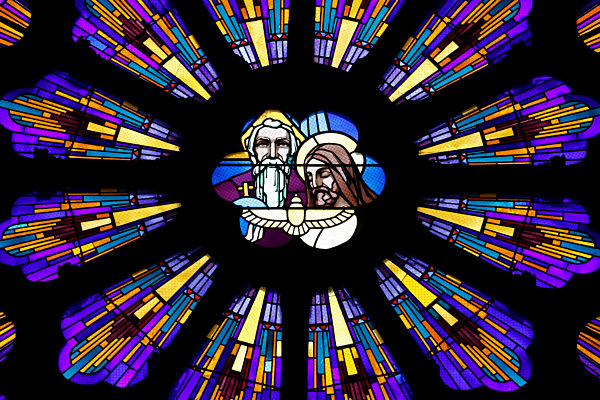 Saint Francois de Sales basilica.  Stained glass window. Holy Trinity. God, Holy Spirit and Jesus.  Thonon. France.