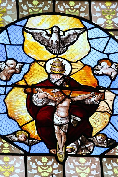 Auxerre cathedral dedicated to Saint Stephan.  Stained glass window. God, Jesus, and Holy Spirit. Holy Trinity.  France.