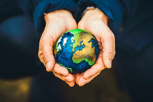 Hands Holding Globe, Climate Protection