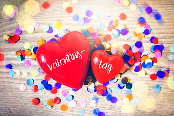 Two Hearts With Confetti And Inscription Valentine's Day