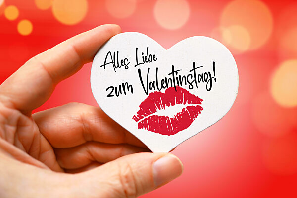 Hand Holding White Heart With Lip Print And Inscription All Love For Valentine's Day