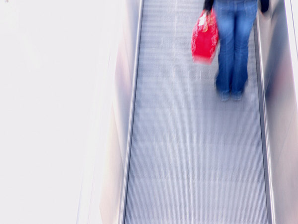 On an escalator upward