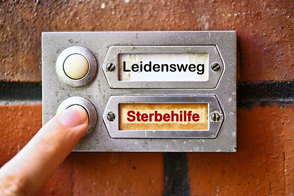 Finger Presses A Bell Button To The Sign Euthanasia